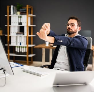 corporate wellbeing program physiotherapy exercise at desk for busy professionals