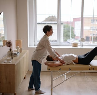 A woman getting a physio massage in her home. The London Physio