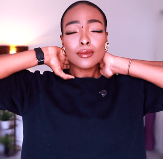 Joy Ogude - a woman physio with her eyes closed and her hands on her painful neck