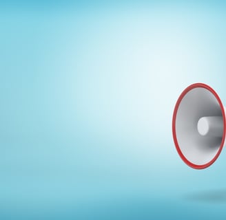 a red and white megaphone on a teal blue background