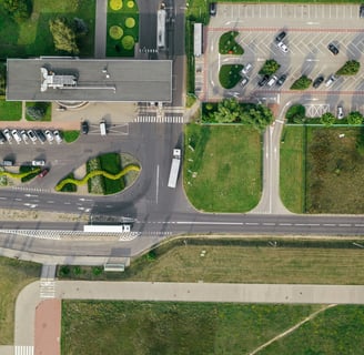 a city street intersection with a lot of cars parked on the side of the road