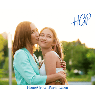 mom hugging teen daughter