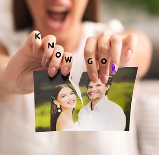 a woman holding up a photo of a man and woman