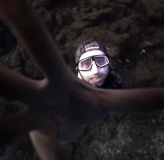 a freediver posing for an underwater photoshoot. Photo taken by Sébastien Saintignan