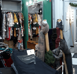 a room with clothes and clothes on display