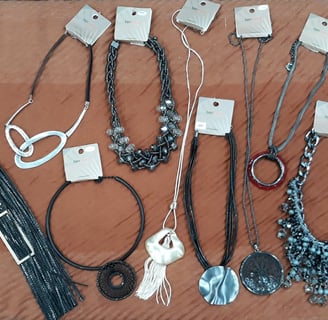 a collection of jewelry and jewelry on a table