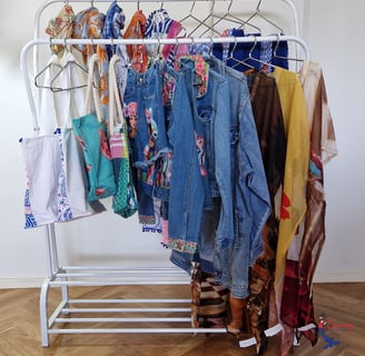 a rack of clothes hanging on a clothes rack