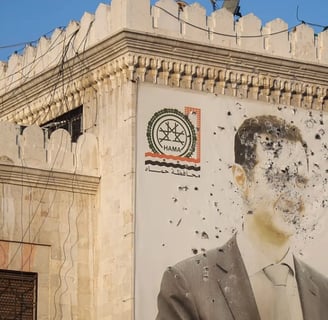 The destroyed facade of Bashar Al Assad