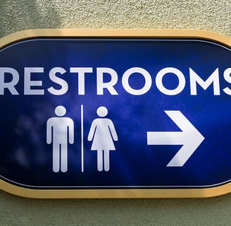 a blue sign with a man and woman restroom sign