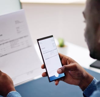 a man holding a phone in his hand