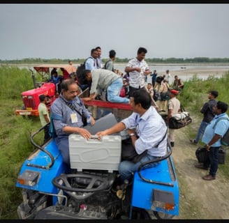 in india. voting machines escorted by security personnel on a tractor