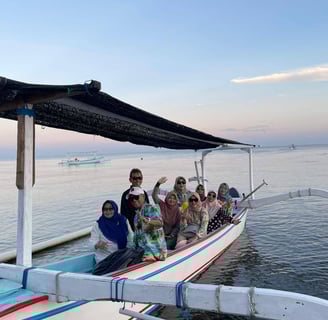 a group of people on a boat in the water at lovina beach