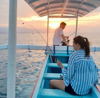 a man and woman waiting sunset for diving jurney on a boat