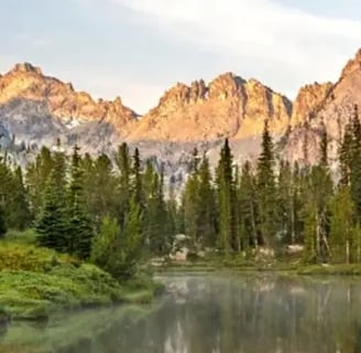 Mountains with a lake and pine trees in Idaho.