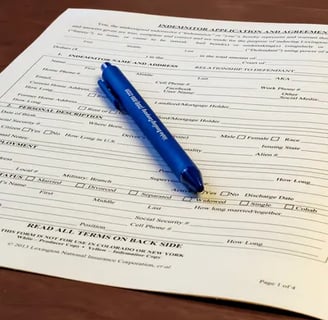 Bail bond application sitting on a table with a pen.