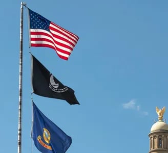 American flag raised above the capital building in Boise Idaho