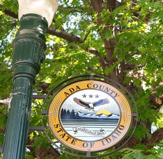 Street light with the Ada County seal displayed in Boise.