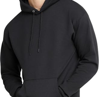 a man in a black hoodie and khaki pants