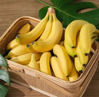 a basket of bananas and a banana peeler
