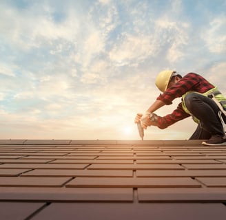 a man in a helmet and a helmet on a roof