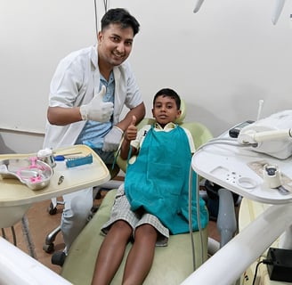 Dr Barun Kant dentist with child after dental treatment at Rps Dental Clinic in Ranchi
