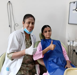 Dr Kamana Vijay Rai dentist at Rps Dental Clinic smiling with happy dental patient