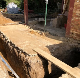 Groundwork contractor overseeing foundation work