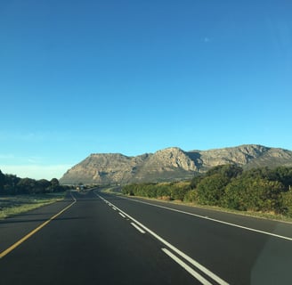 clean street with mountains in backround