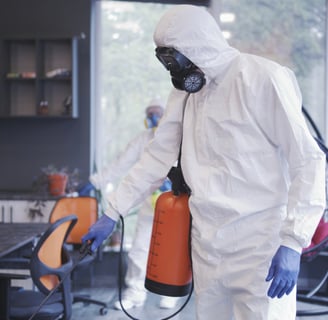 a man in a white suit and a gas canister