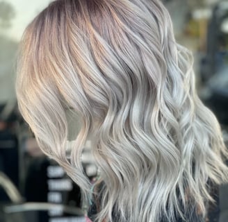 a woman with silver blonde cool ash hair 