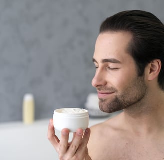 a man applying beard balm