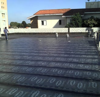 a man standing on a roof top with a lot of numbers on it