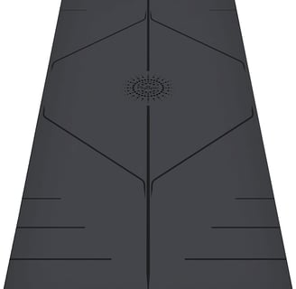 a yoga mat with a black and white mat