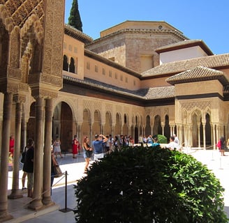 morocco fes a courtyard with a lot of people walking around