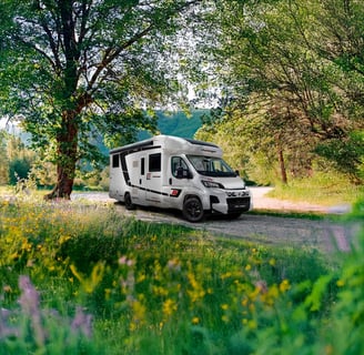 a camper van parked on a dirt road in morocco
