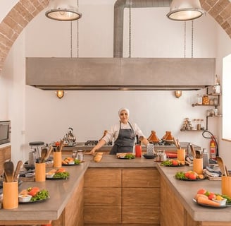 morocco gastronomy a woman in a kitchen with a large archway