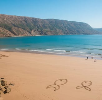 Morocco a couple of people walking on a beach