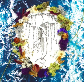 humpback whale drawing surrounded by flowers and ocean 