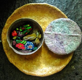 Recycled paper purple jewelry case opened on recycle paper brown plae