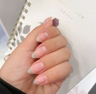 a person's hand without nail polish and Long almond shaped nails