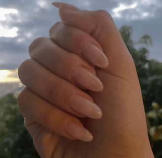 hand showing nude pink manicure, natural looking manicure