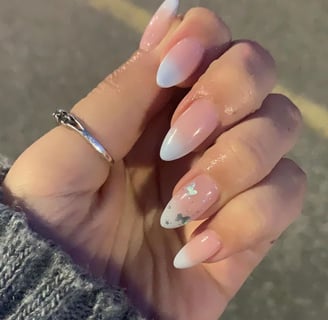 ombre baby blue manicure with sparkle butterfly accent nail on ring finger