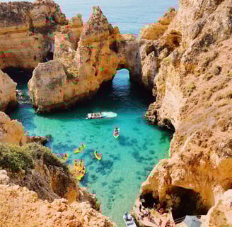 a boat in the water near a cliff