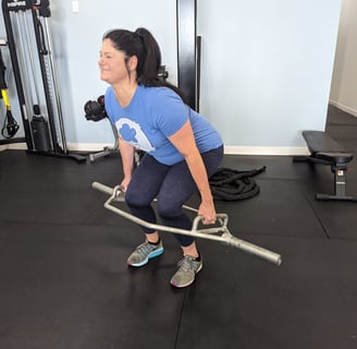 Christi lifting heavy with the hex bar