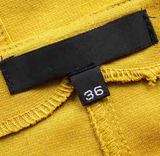 Rongzhiyue: Size label on yellow fabric
