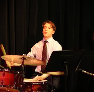 Aiden Schram, Drummer, playing the drums.