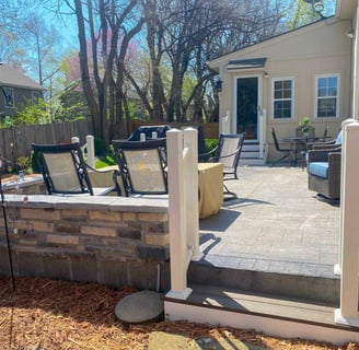 Applying a sealant to a stamped concrete patio in Lee’s Summit for added protection.