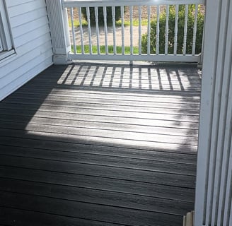 This aged porch was reframed in Ligonier, IN. Composite decking completed the renovation.