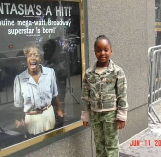 Image of 6 year old Valicia Carmen attending the original Broadway production of The Color Purple