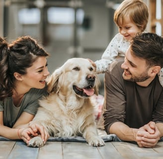 people and the family pet sharing a happy moment